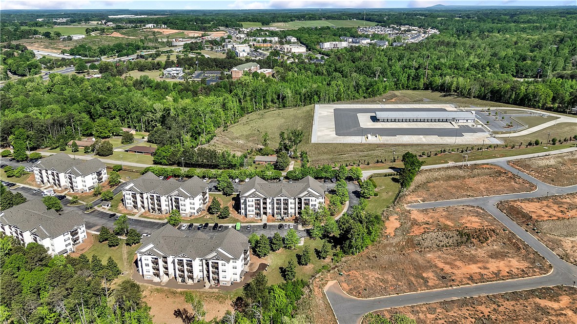 726 Lookover Drive Anderson, SC 29621 - Photo 32 of 32 This expansive aerial view showcases a vibrant community nestled among lush trees.