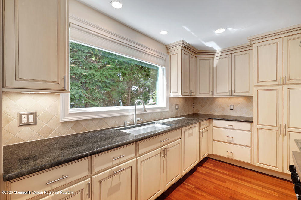 27 Southern Way Princeton, NJ 08540 - Photo 11 of 63 a kitchen with granite countertop white cabinets and a window