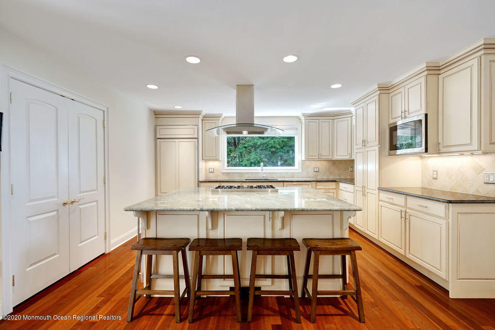 27 Southern Way Princeton, NJ 08540 - Photo 13 of 63 a kitchen with kitchen island a dining table chairs cabinets and stainless steel appliances