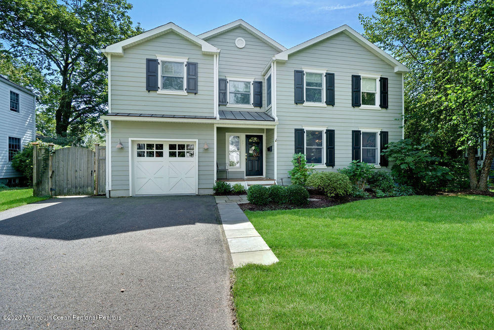 27 Southern Way Princeton, NJ 08540 - Photo 2 of 63 a front view of a house with a yard and garage
