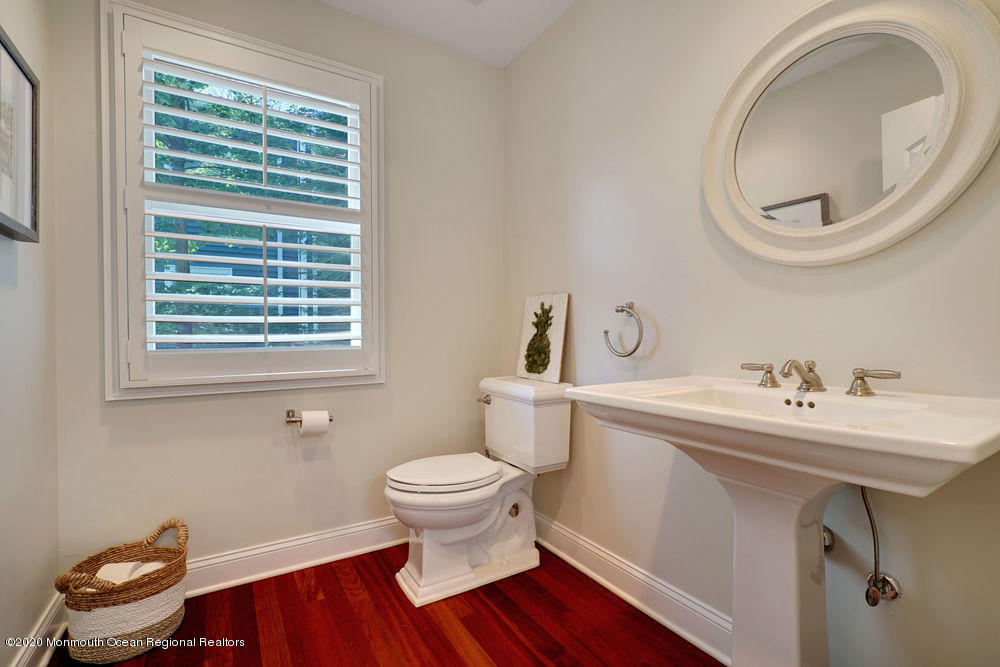 27 Southern Way Princeton, NJ 08540 - Photo 26 of 63 a bathroom with a sink a toilet and a mirror