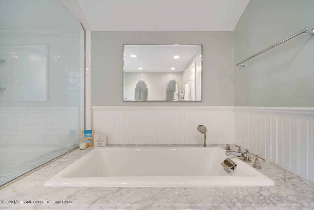27 Southern Way Princeton, NJ 08540 - Photo 34 of 63 a bathroom with a tub sink and mirror