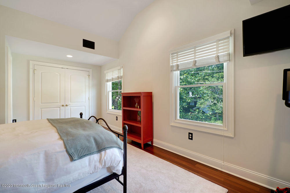 27 Southern Way Princeton, NJ 08540 - Photo 40 of 63 a spacious bedroom with a bed and a flat screen tv