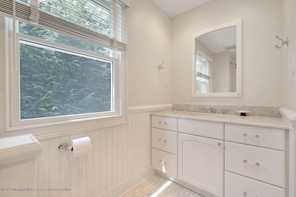 27 Southern Way Princeton, NJ 08540 - Photo 43 of 63 a bathroom with a sink mirror and a window