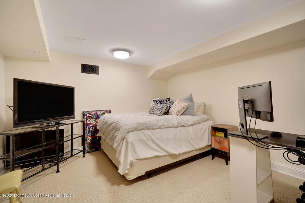 27 Southern Way Princeton, NJ 08540 - Photo 50 of 63 a spacious bedroom with a bed and a flat screen tv