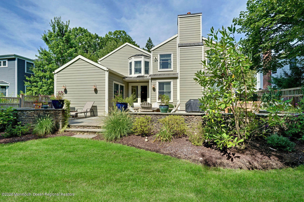 27 Southern Way Princeton, NJ 08540 - Photo 52 of 63 a front view of a house with a yard and potted plants