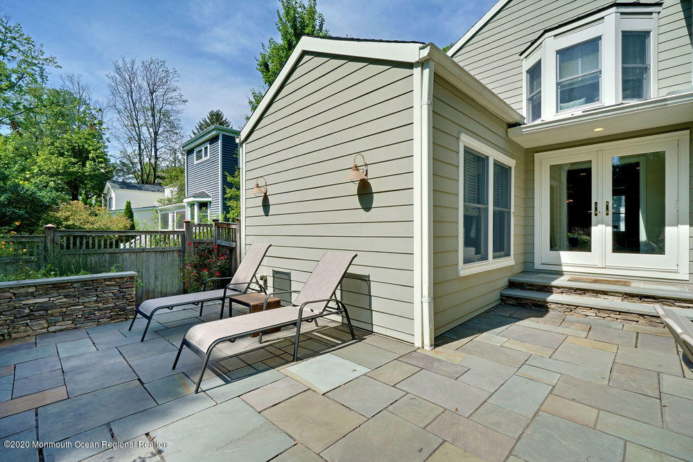 27 Southern Way Princeton, NJ 08540 - Photo 58 of 63 a view of a patio with table and chairs and wooden fence