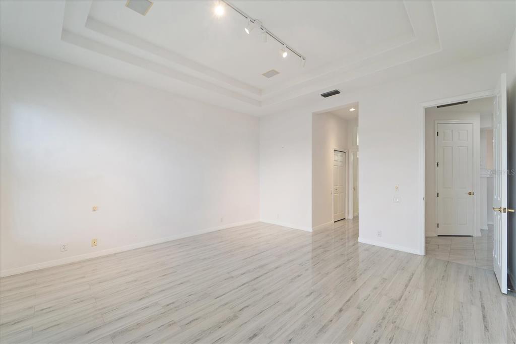6585 Waters Edge Way Lakewood Ranch, FL 34202 - Photo 19 of 59 wooden floor in an empty room