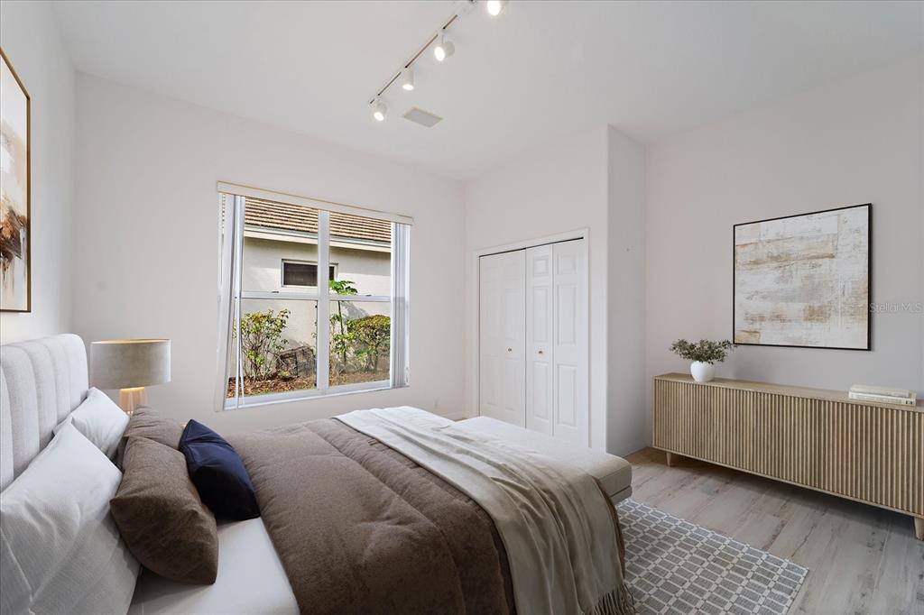 6585 Waters Edge Way Lakewood Ranch, FL 34202 - Photo 22 of 59 a bedroom with a bed and a window