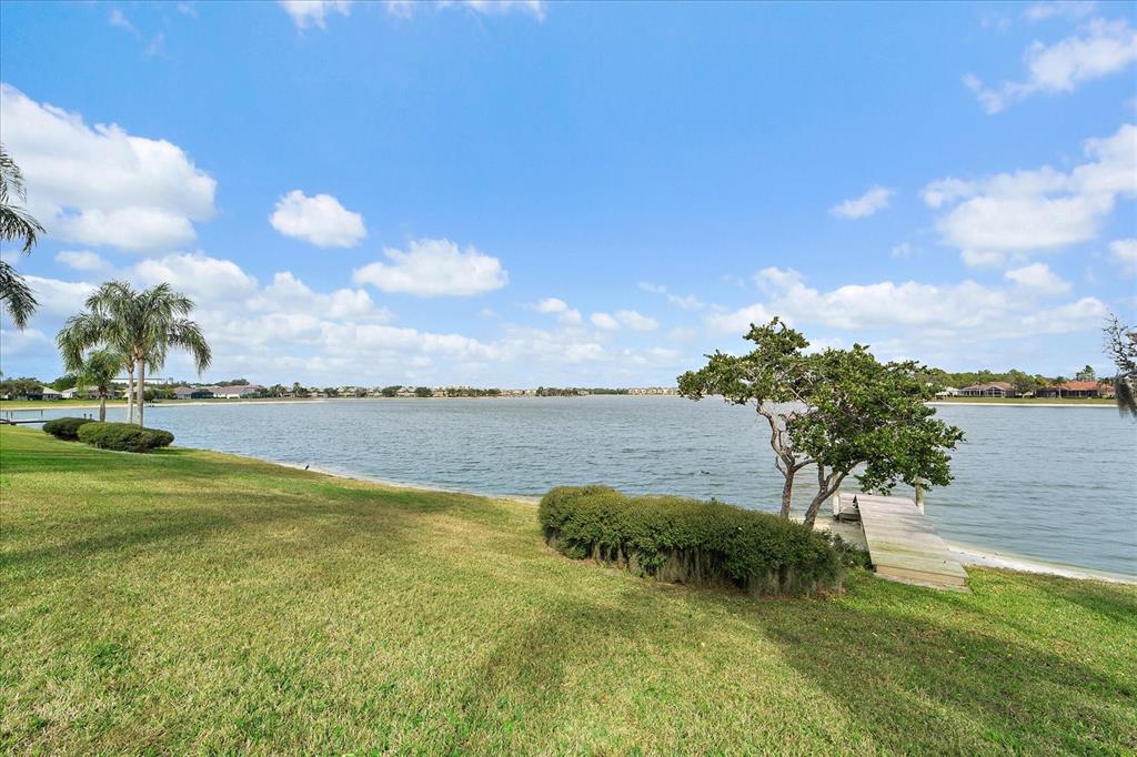 6585 Waters Edge Way Lakewood Ranch, FL 34202 - Photo 41 of 59 a view of a lake from a yard