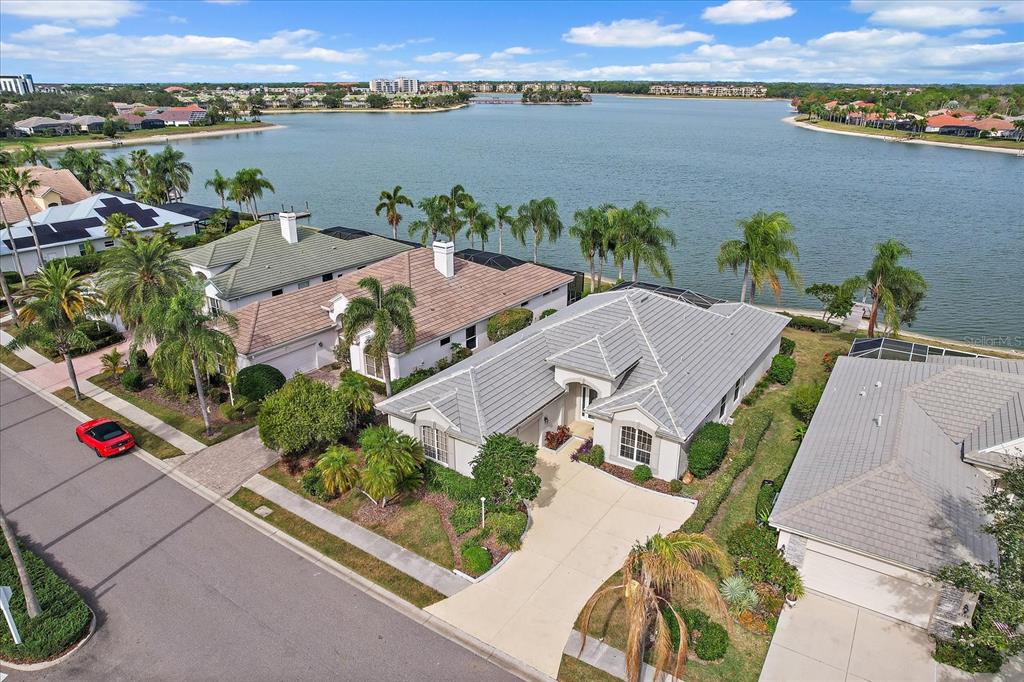 6585 Waters Edge Way Lakewood Ranch, FL 34202 - Photo 43 of 59 an aerial view of houses with yard