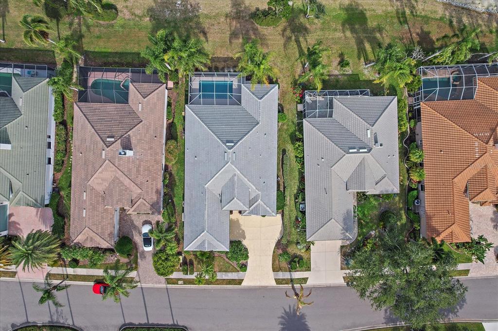 6585 Waters Edge Way Lakewood Ranch, FL 34202 - Photo 44 of 59 an aerial view of houses with outdoor space