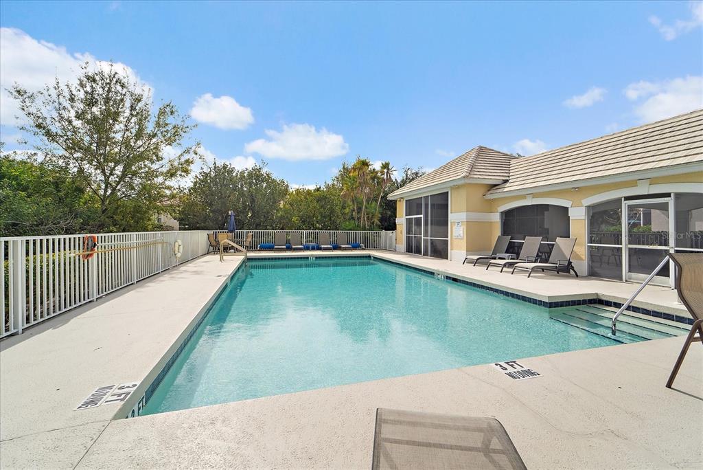 6585 Waters Edge Way Lakewood Ranch, FL 34202 - Photo 46 of 59 a view of a patio with swimming pool table and chairs
