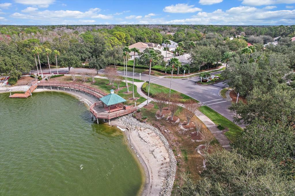 6585 Waters Edge Way Lakewood Ranch, FL 34202 - Photo 49 of 59 a view of a lake with a yard