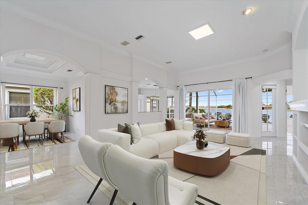 6585 Waters Edge Way Lakewood Ranch, FL 34202 - Photo 6 of 59 a living room with furniture and a large window