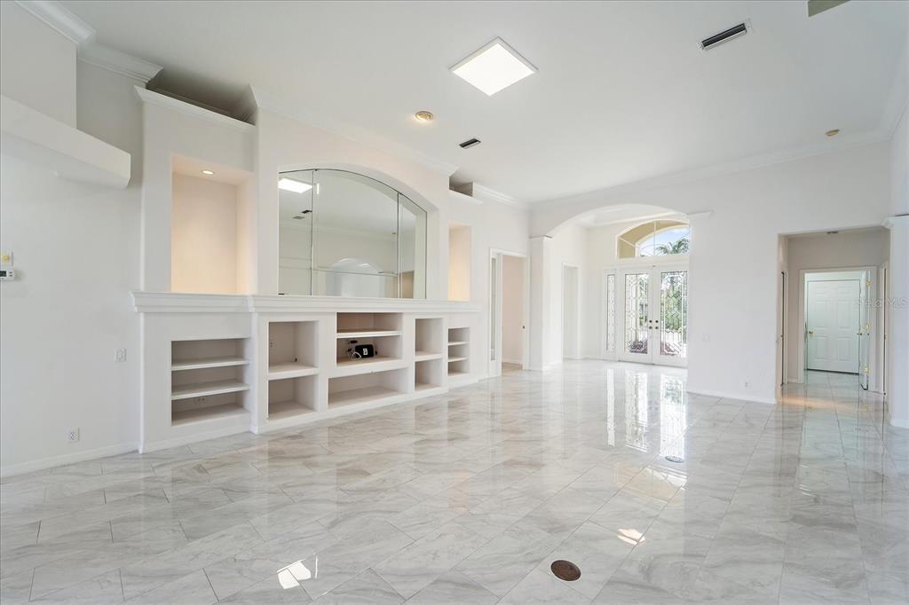 6585 Waters Edge Way Lakewood Ranch, FL 34202 - Photo 8 of 59 wooden floor in an empty room with a kitchen