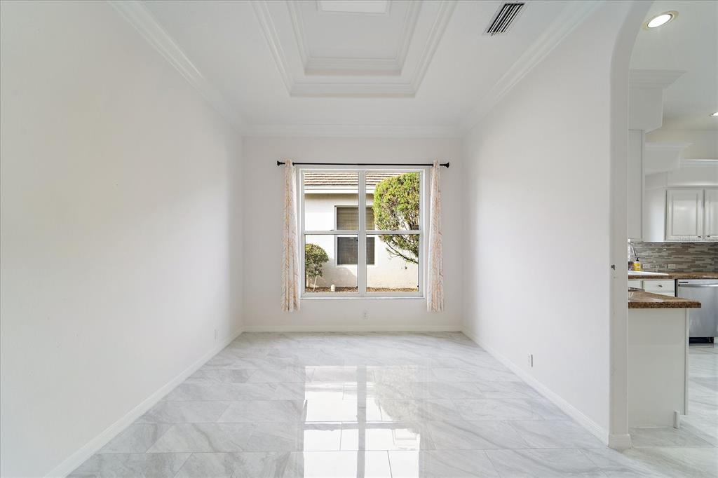 6585 Waters Edge Way Lakewood Ranch, FL 34202 - Photo 10 of 59 an empty room with windows