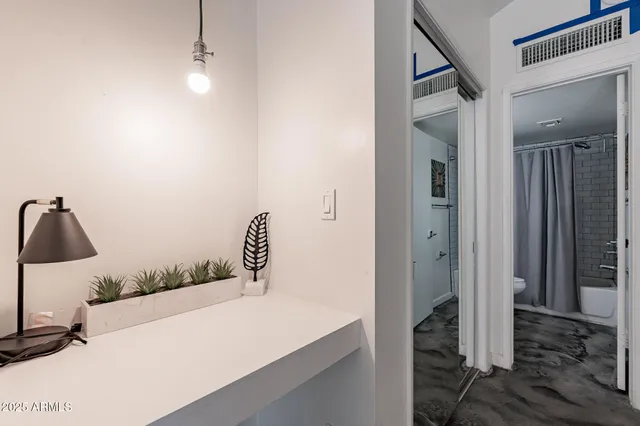 a bathroom with a sink and mirror