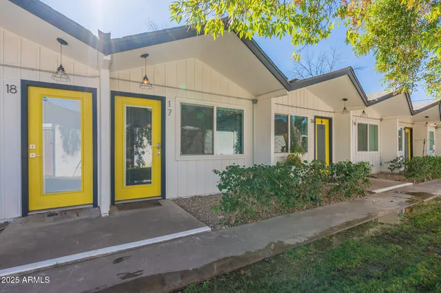 a view of a brick house with a large windows