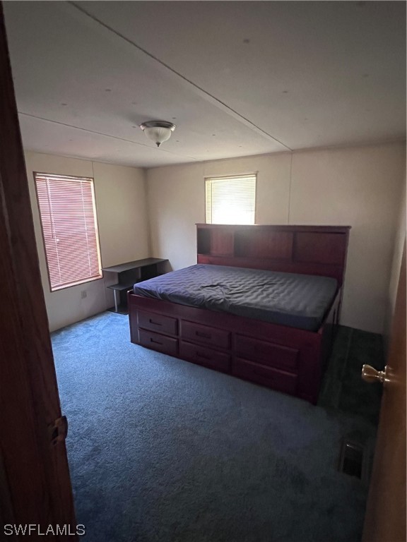 853 Reddish Circle Clewiston, FL 33440 - Photo 12 of 17 a bedroom with a bed and window