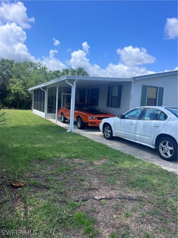 853 Reddish Circle Clewiston, FL 33440 - Photo 17 of 17 a view of a house with a yard and sitting area