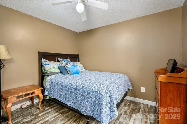 a bedroom with a bed and cabinets
