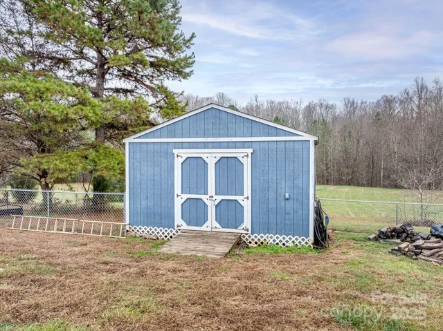 a house with trees in the background