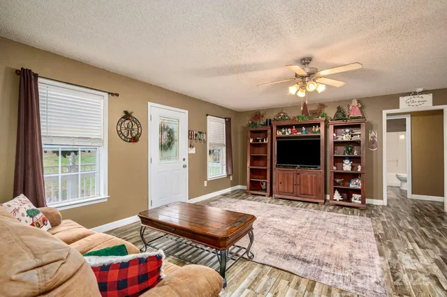 a living room with furniture and a flat screen tv