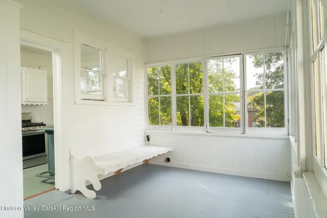a bathroom with a bathtub and a window