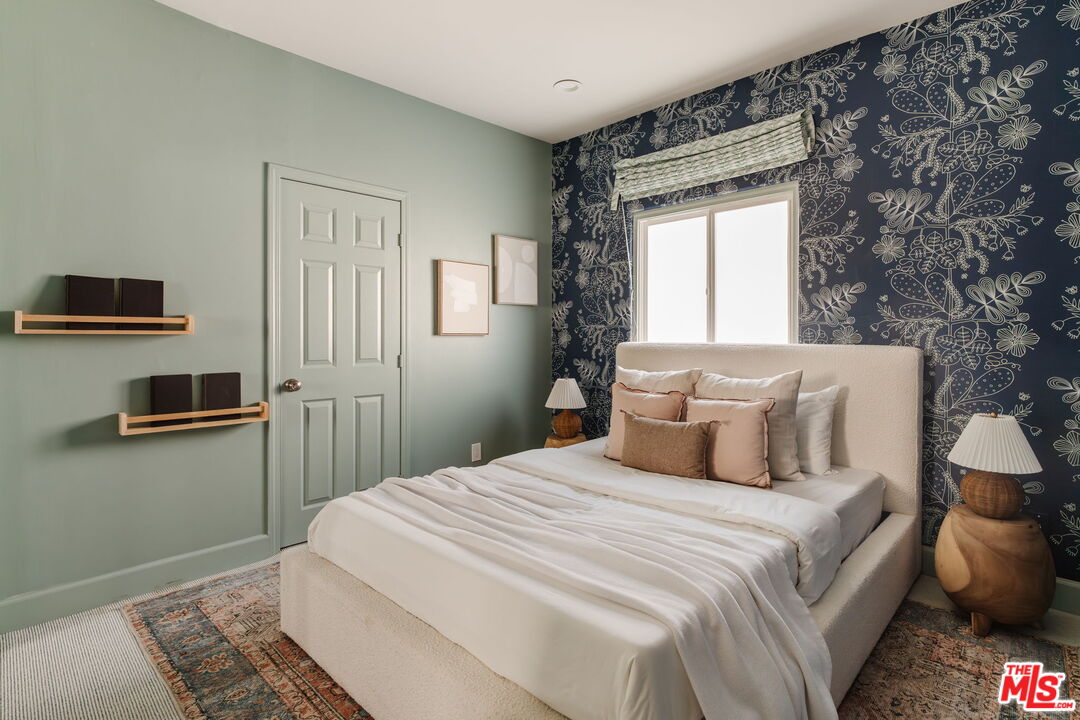 131 Galleon Street, Unit 2 Marina del Rey, CA 90292 - Photo 12 of 21 a bedroom with a bed and wooden floor