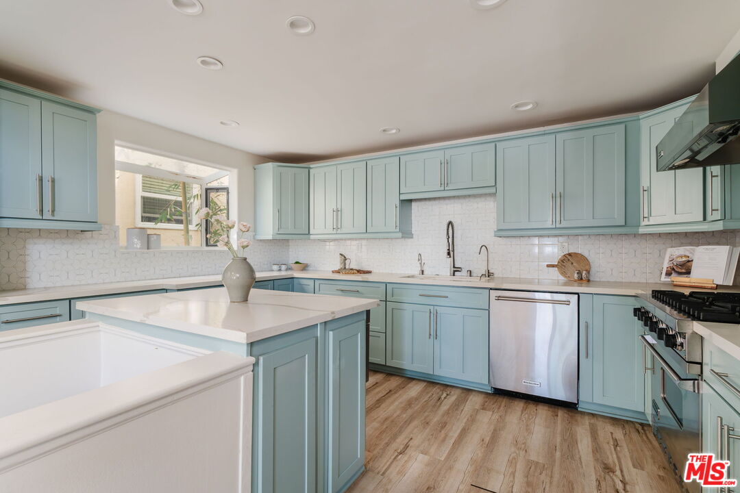 131 Galleon Street, Unit 2 Marina del Rey, CA 90292 - Photo 4 of 21 a kitchen with sink cabinets and wooden floor