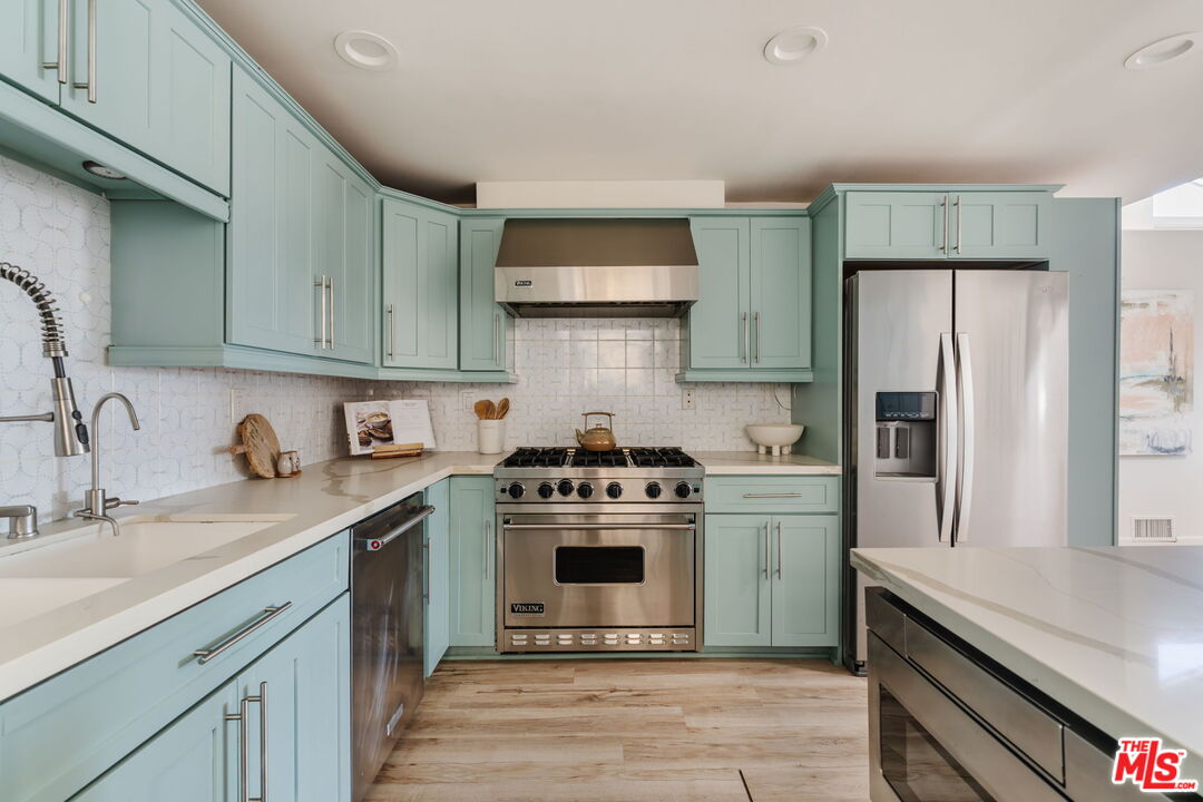 131 Galleon Street, Unit 2 Marina del Rey, CA 90292 - Photo 5 of 21 a kitchen with a stove sink and refrigerator