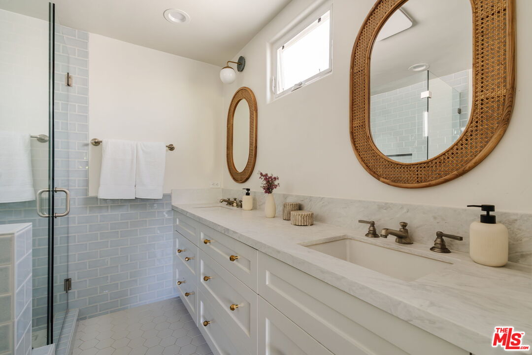 131 Galleon Street, Unit 2 Marina del Rey, CA 90292 - Photo 9 of 21 a bathroom with a double vanity sink mirror and shower