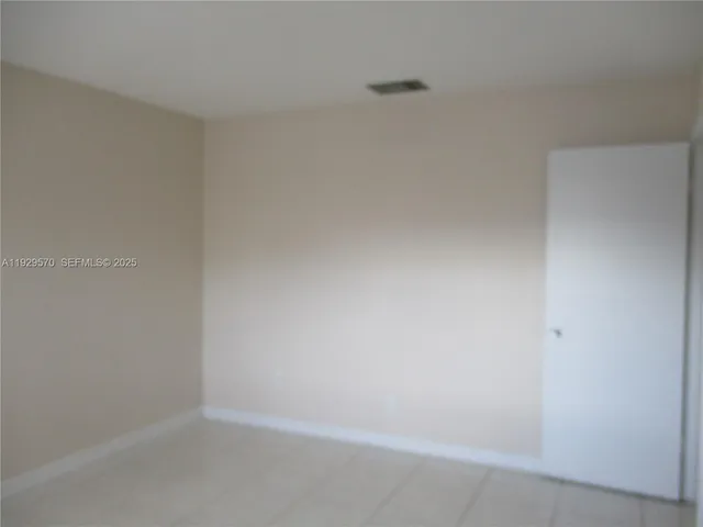 a bathroom with a shower and toilet