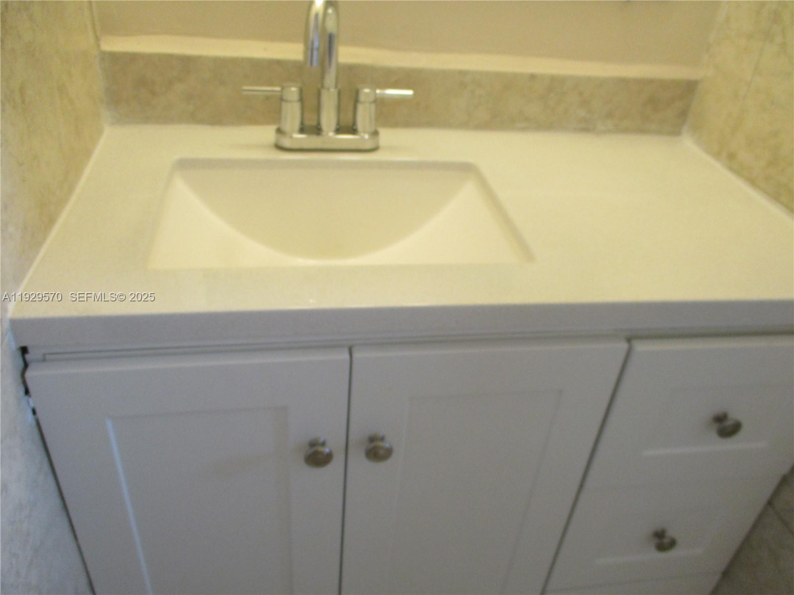 3500 Harrison Street, Unit 11 Hollywood, FL 33021 - Photo 14 of 16 a bathroom with a bathtub
