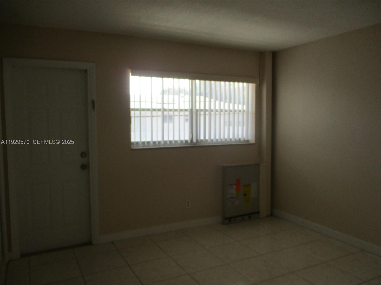 3500 Harrison Street, Unit 11 Hollywood, FL 33021 - Photo 10 of 16 an empty room with a window