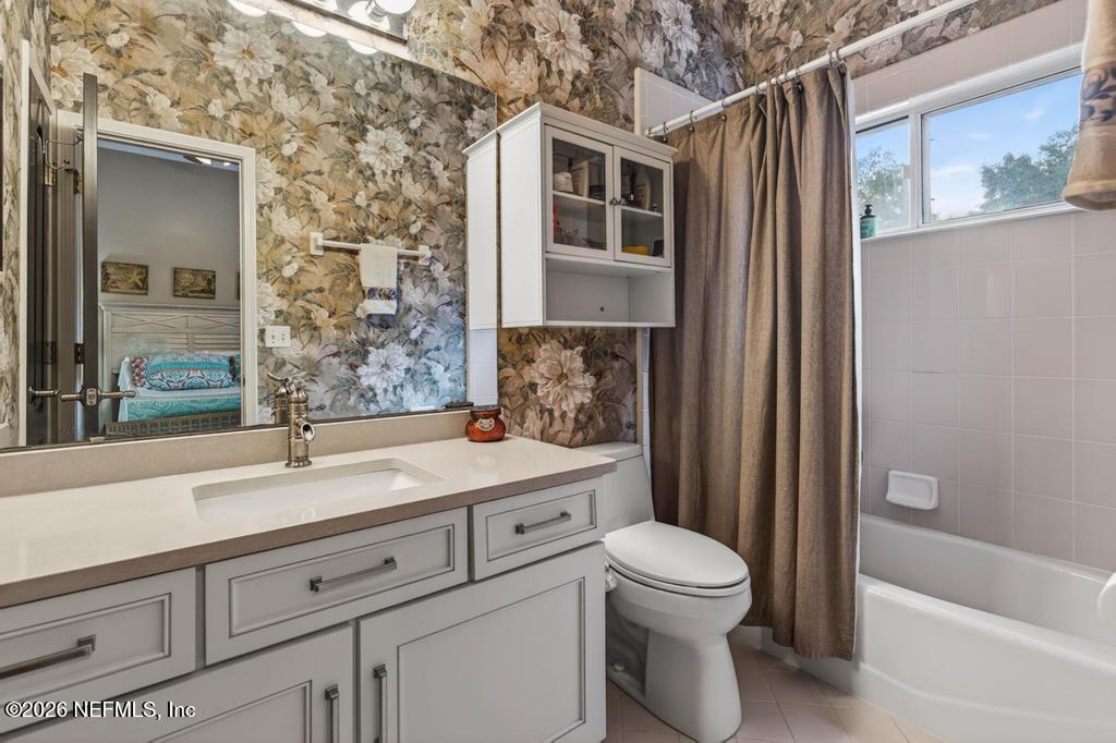 1483 Bridgette Way Fleming Island, FL 32003 - Photo 31 of 63 a bathroom with a sink toilet and shower