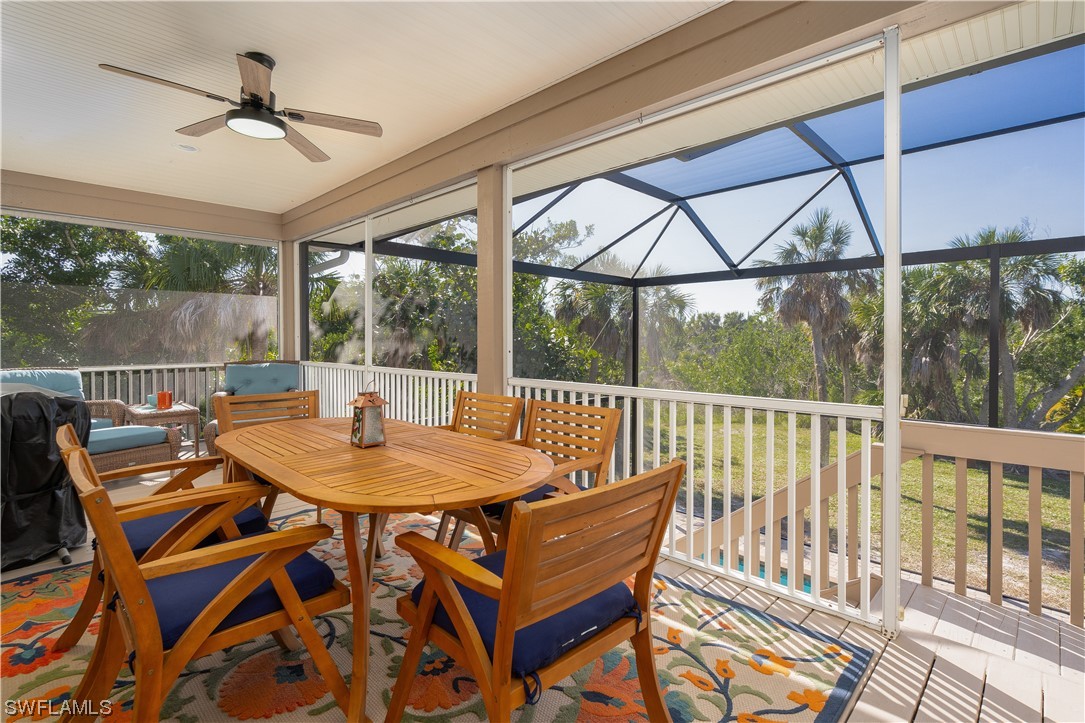 2130 Sunset Circle Sanibel, FL 33957 - Photo 13 of 36 a view of a dining room with furniture window and outside view