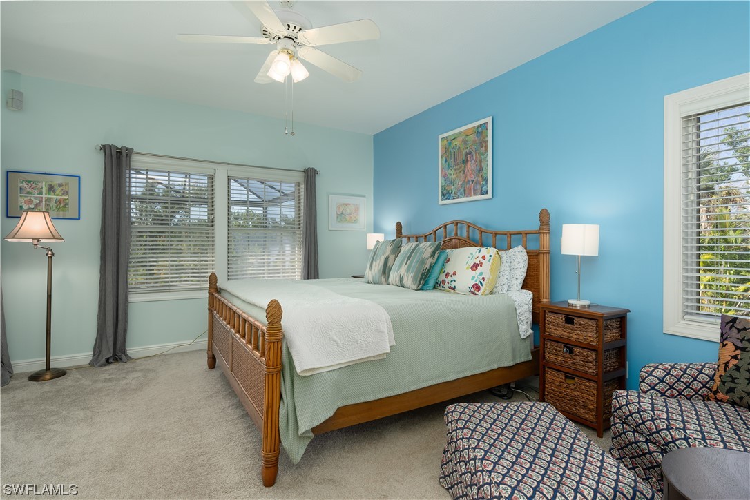 2130 Sunset Circle Sanibel, FL 33957 - Photo 16 of 36 a bedroom with a bed and window