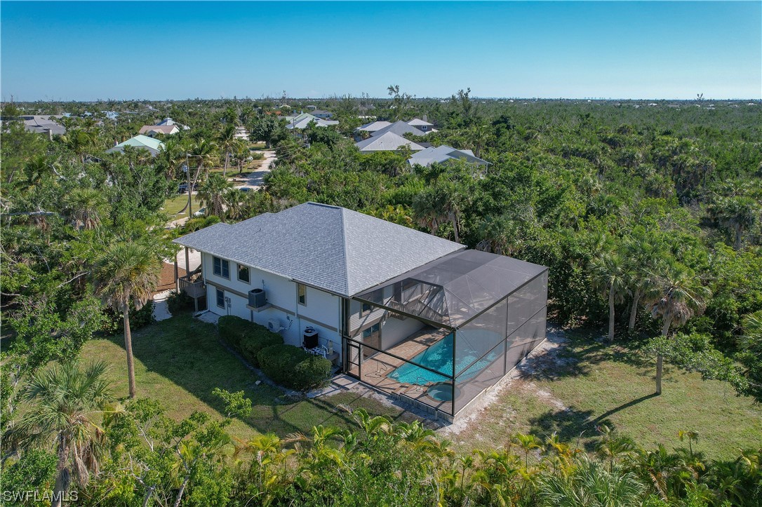 2130 Sunset Circle Sanibel, FL 33957 - Photo 27 of 36 an aerial view of a house with a garden