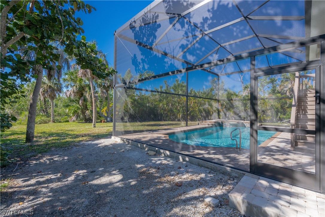 2130 Sunset Circle Sanibel, FL 33957 - Photo 28 of 36 a view of a yard