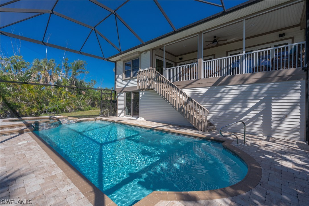 2130 Sunset Circle Sanibel, FL 33957 - Photo 29 of 36 a view of a backyard with seating area