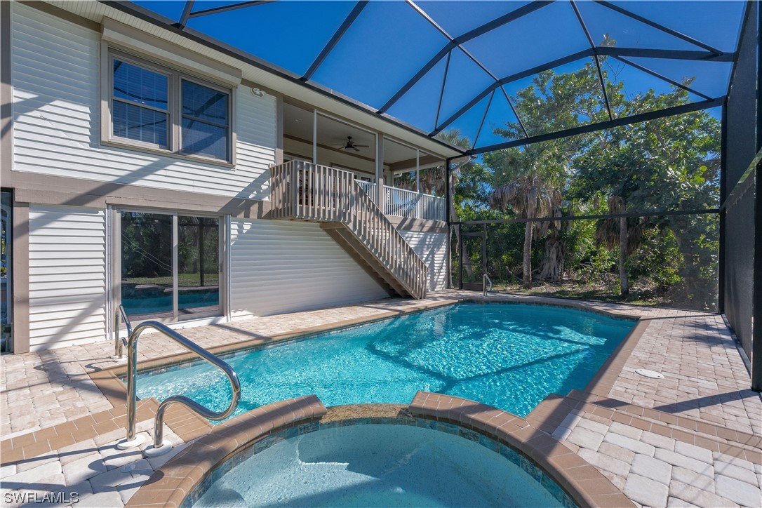 2130 Sunset Circle Sanibel, FL 33957 - Photo 30 of 36 a view of a backyard with a small cabin and sitting area
