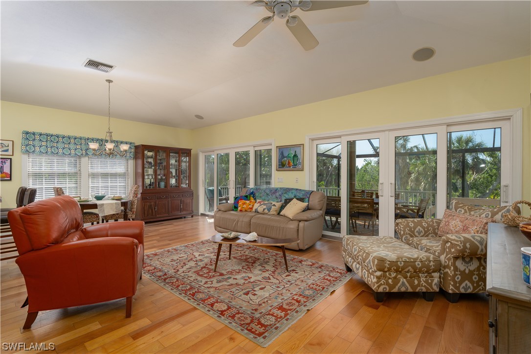 2130 Sunset Circle Sanibel, FL 33957 - Photo 6 of 36 a living room with furniture and a large window