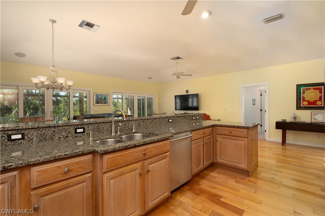 2130 Sunset Circle Sanibel, FL 33957 - Photo 10 of 36 a view of a kitchen with a sink and large window