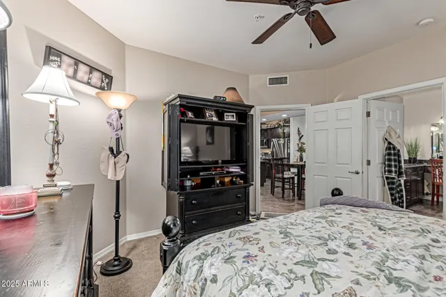 a bedroom with a bed and a bathroom