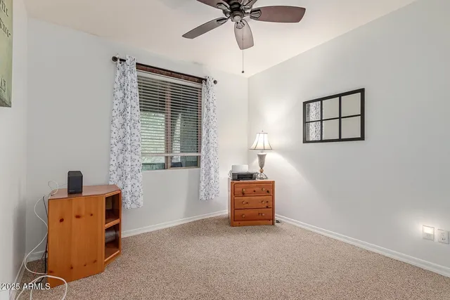 a view of workspace with furniture and window