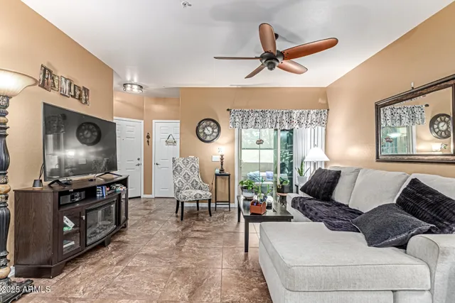 a living room with furniture and a flat screen tv