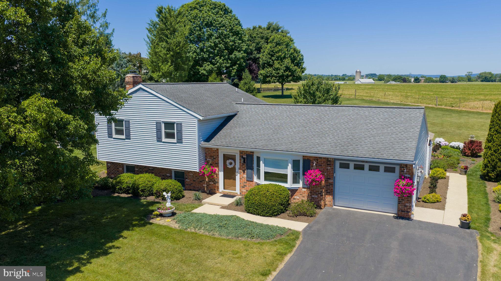 91 Buchland Road Ephrata, PA 17522 - Photo 1 of 59 Charming home with lush greenery.