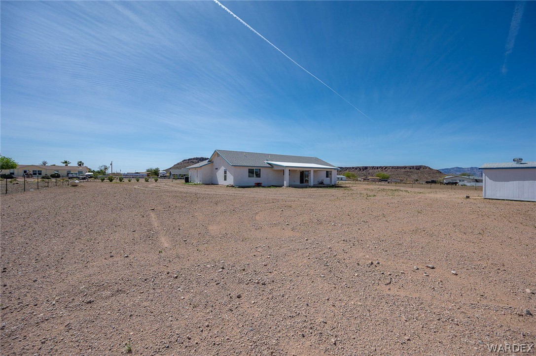 3411 West Carmichael Road Golden Valley, AZ 86413 - Photo 49 of 97 Rear view of house